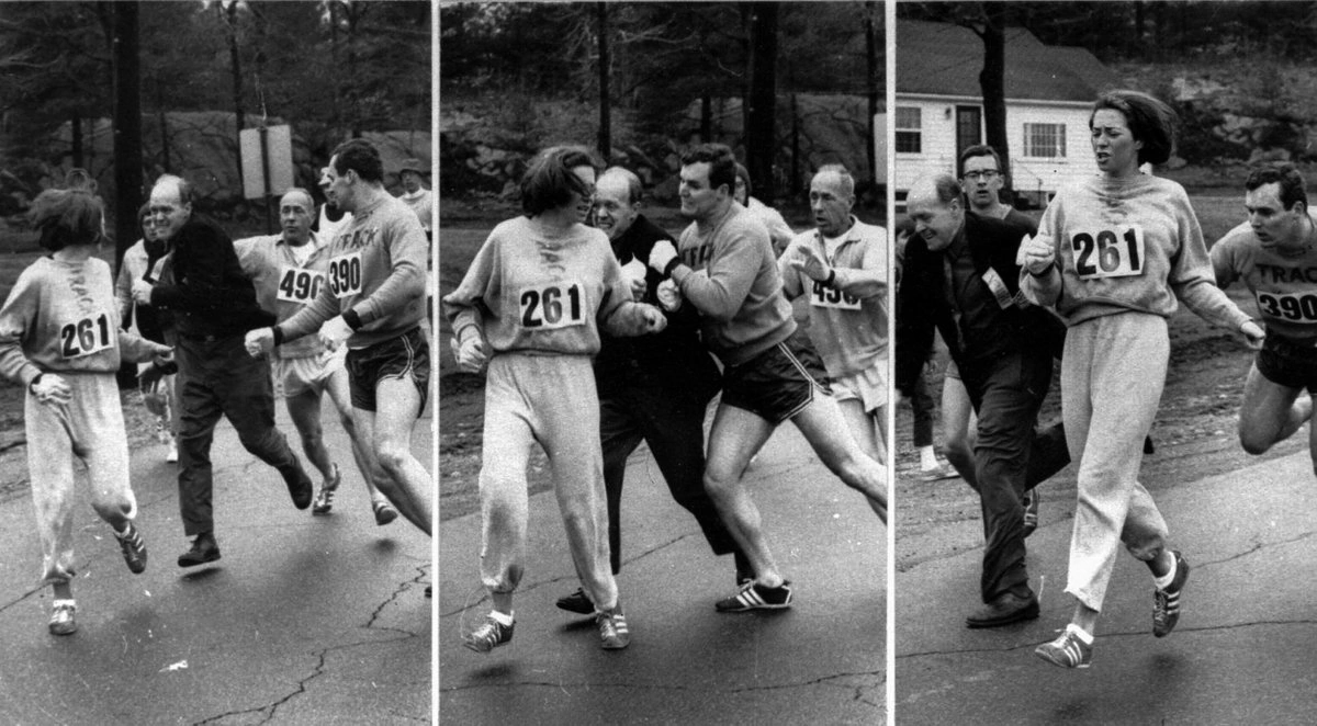 K. Switzer corriendo con el dorsal 261 en la Maratón de Boston de 1967, mientras Jock Semple trata de agarrarla y su compañero Thomas Miller lo empuja y quita del camino. Crédito:: Boston Herald